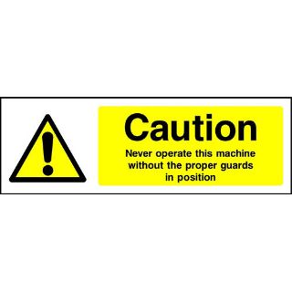 Picture of "Caution-Never Operate This Machine Without The Proper Guards In Position" Sign 