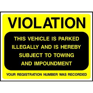 Picture of "Violation- This Vehicle Is Parked Illegally And Is Herby Subject To Towing And Impoundment" Sign 